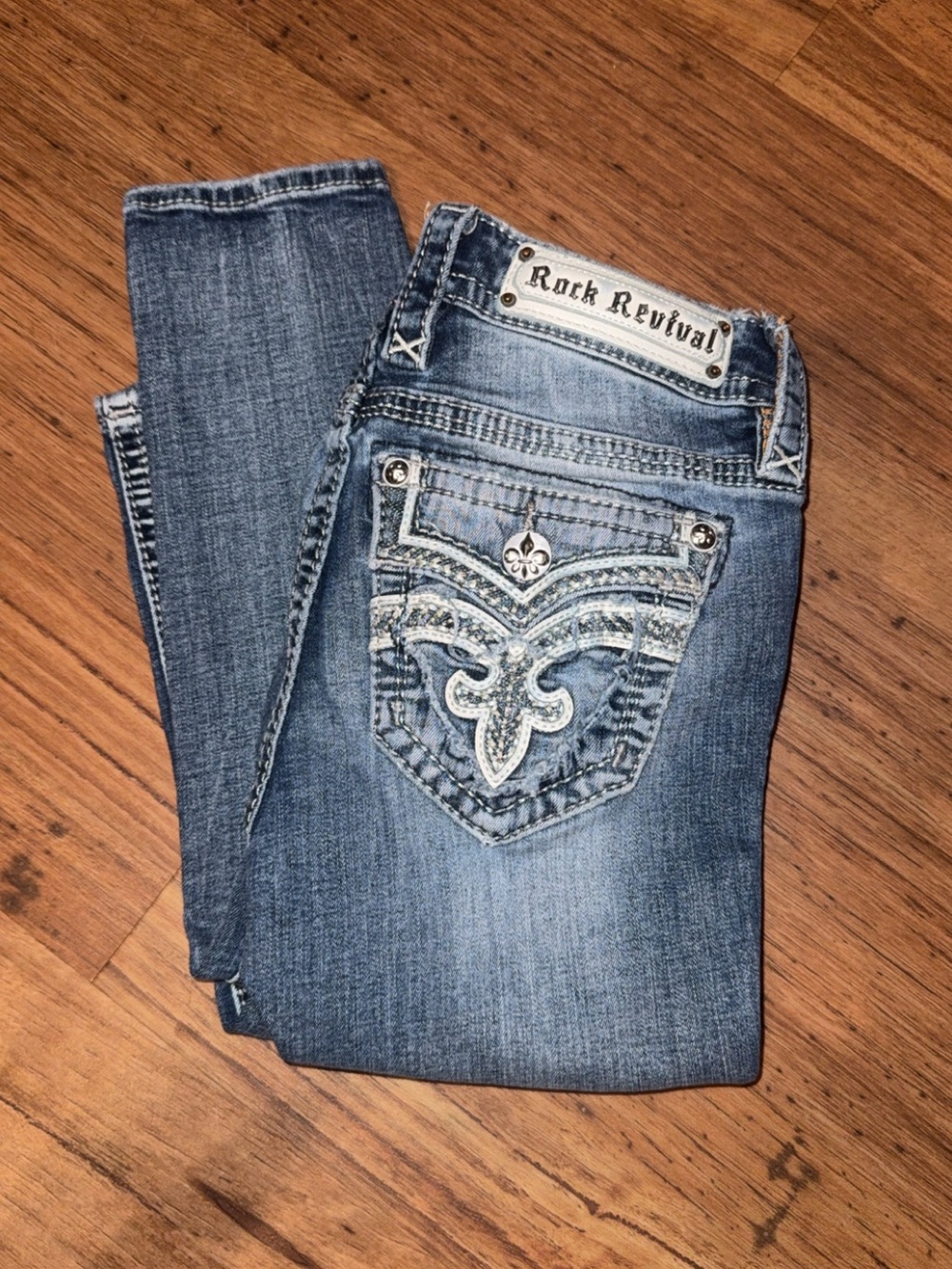 ROCK REVIVAL MID RISE SKINNY JEANS